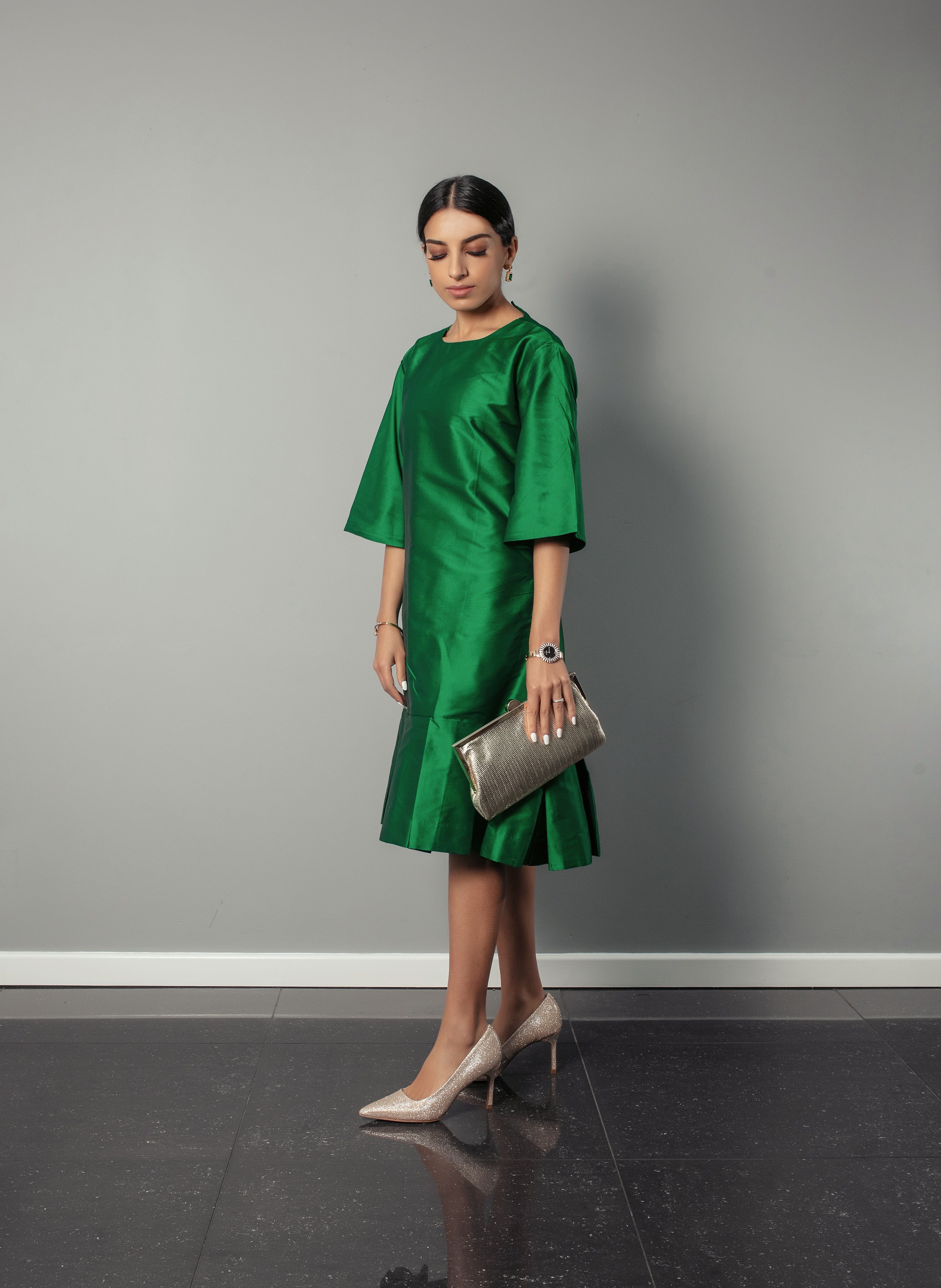 Emerald green silk relaxed fit dress with pleating detail