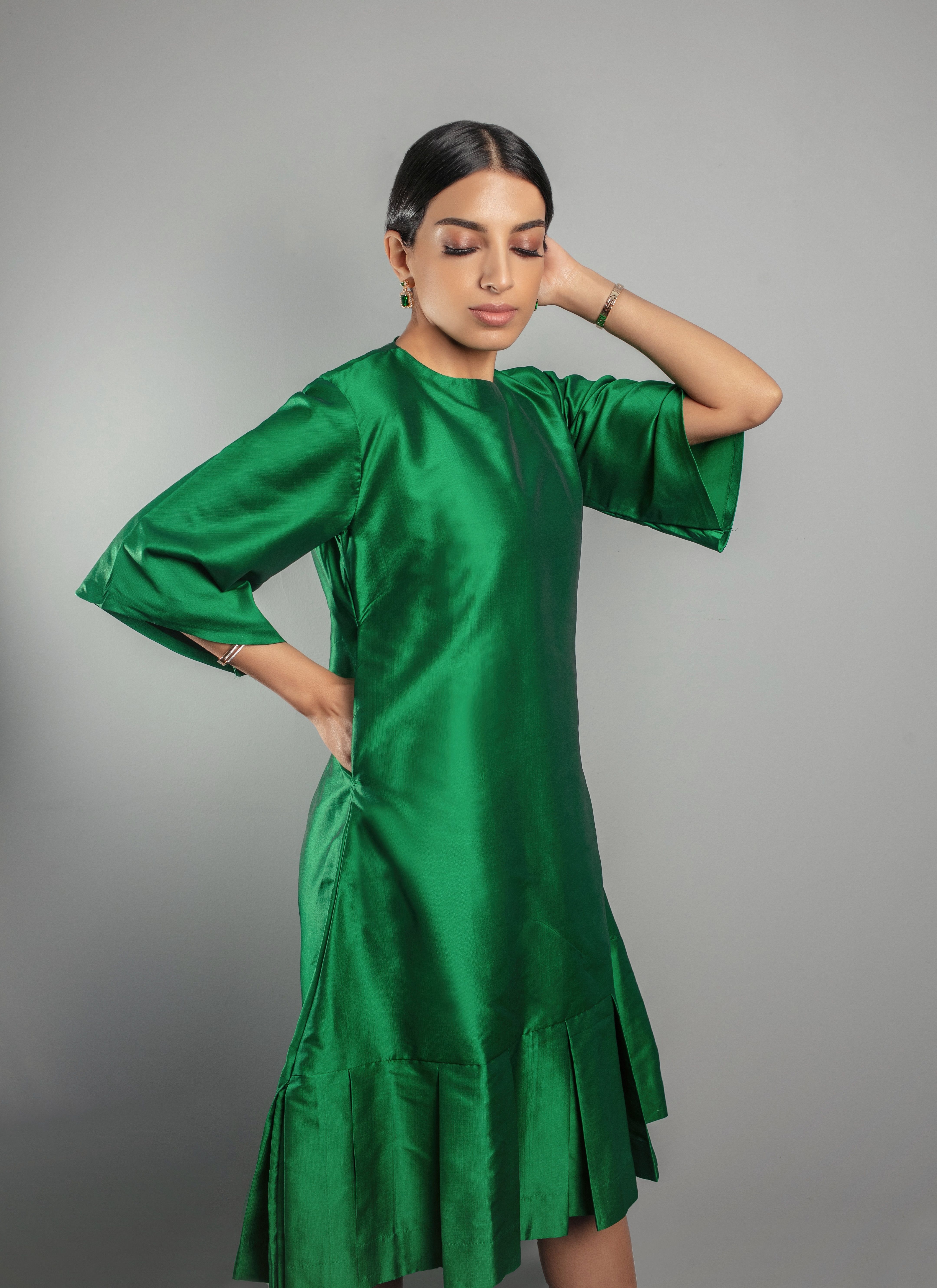 Emerald green silk relaxed fit dress with pleating detail